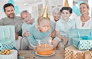 She knows what she wants. Cropped shot of a happy family celebrating a birthday together at home.