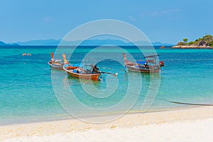 Ko Lipe, Thailand. Long-tail boats in azure seawaters