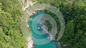 Kobarid, Slovenia - 4K Aerial footage about drone flying above River Soca on a sunny summer aftwernoon