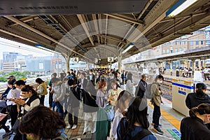 Kobe, Japan - May 6, 2023: Passengers wait on platform at JR Sannomiya Station due to train delay
