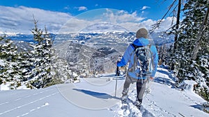 Kobesnock - Man with hiking poles standing on snow edge after heavy snowfall on the way to Kobesnock in Bad Bleiberg,