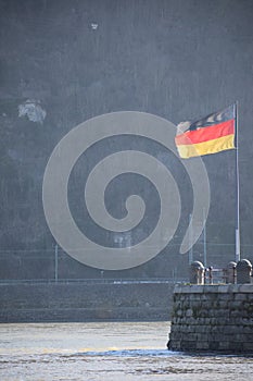 Koblenz, Germany - 02 27 2022: German flag waving in the wind of Rhine and Mosel