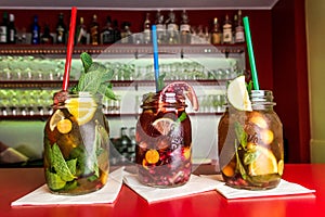 Koblenz, Germany 03.04.18 Homemade lemonade ice tea colorful icetea drink fresh sweet fruits mint glass with straw