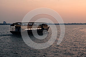 Kochi, India - June 2, 2017: Fishing nets at sunset photo