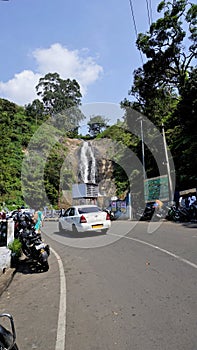 kodaikanal Silver Cascade Waterfall with tourists from the Dindigul Kodai route
