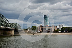 Koeln Cologne Triangle building and Hohenzollern bruecke bridge with Rhine river, Germany