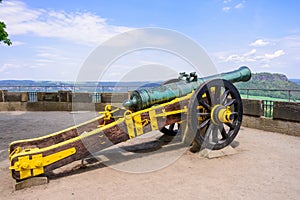 KOENIGSTEIN, GERMANY - MAY 2017: a gun carriage decorated in yellow and black in Konigstein Fortress. These siege guns used in Eu