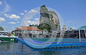 Koh Panyee, Thailand a floating village with an incredible rocky backdrop and a famous floating soccer field.