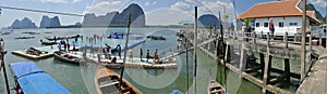 Koh Panyee, Thailand a floating village with an incredible rocky backdrop and a famous floating soccer field.