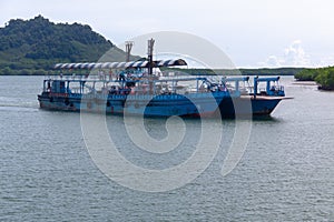 KOH PHANGAN, THAILAND - AUGUST 31, 2013: Ferry boat conveying passengers to Koh Phangan island port.