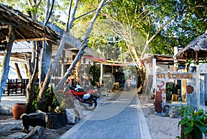 KOH TAO, THAILAND, Island life. A pedestrian street along the coast of Sayri beach is sometimes used by motorcycles