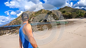 Koka Beach - A young man taking a selfie on an idyllic beach