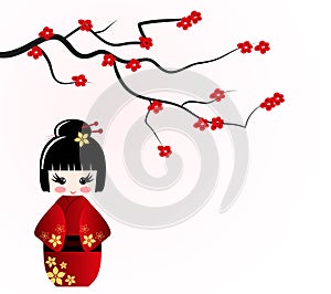 Kokeshi doll under sakura branch