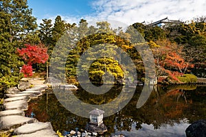 Koko-en autumn garden with skyline reflection on pond, Himeji