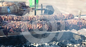 Kokorec and lamp spits on coals fire. Greek Easter, Monastiraki, Athens Greece