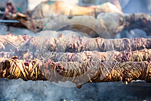 Kokorec and lamp spits on coals fire. Greek Easter, Monastiraki, Athens Greece