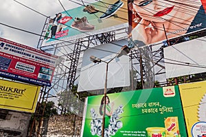 KOLKATA, INDIA - OCTOBER 31, 2016: Wall of posters and billbards in the center of Kolkata, Ind