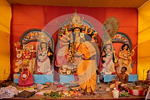 Priest worshipping Goddess Durga, Durga aarti, Durga Puja festival celebration