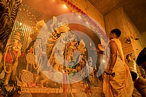 Priest worshipping Goddess Durga, Durga Puja festival celebration