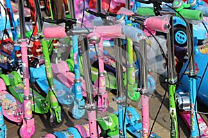 Colorful children`s scooter for sell on an open shop, at Esplanade, Kolkata.