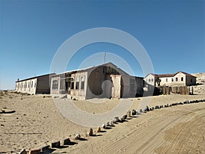 Kolmanskop `afrique. Kolmanskop, German. Kolmannskuppe is an abandoned town in Namibia, located in the Namib desert.