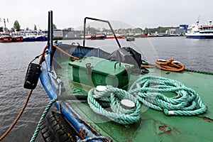 Kolobrzeg, zachodniopomorskie / Poland - May, 14, 2021:Mooring ropes laid on the deck of a fishing boat. A fishing port in a small