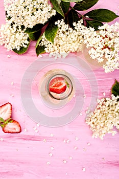 Kombucha tea with elderflower flower and strawberry