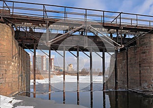 Kommunar dam, a pedestrian bridge over the Miass river