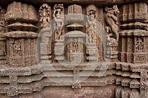 Ancient sandstone carvings on the walls of the ancient 13th century sun temple at Konark, Odisha, India.