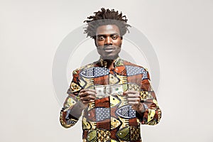 Kongo businessman holding one dollar and looking at camera