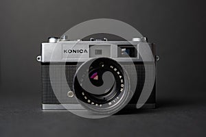 Konica vintage rangefinder camera auto s 1.6 35mm on a black background.