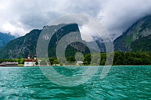 Konigsee lake with st Bartholomew church surrounded by mountains, Berchtesgaden National Park, Bavaria, Germany