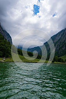 Konigsee lake with st Bartholomew church surrounded by mountains, Berchtesgaden National Park, Bavaria, Germany