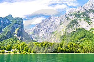 Konigssee lake with clear green water, reflection, mountains and sky background, Bavaria, Germany