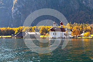 Konigssee lake Konigsee in foggy weather, St. Bartholoma church the background Watzmann mountains , near the German Austrian