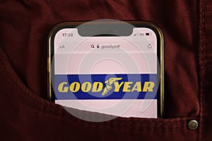 KONSKIE, POLAND - August 17, 2021: Goodyear Tire and Rubber Company logo on mobile phone hidden in jeans pocket