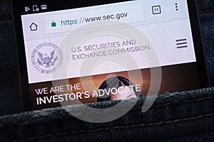 U.S. Securities and Exchange Commission website displayed on smartphone hidden in jeans pocket