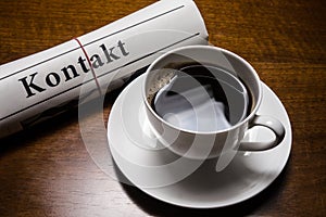 Kontakt newspaper, cup of coffee