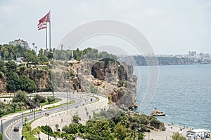 Konyaalti beach in Antalya, Turkey. Long Turkish beach on the Mediterranean sea in warm sunny summer weather. Rest of