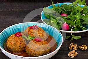 Koofteh Tabrizi Large Meatballs Stuffed With Dried Fruits, Berries And Nuts In Tomato Turmeric Broth A Traditional Azeri And Iran photo