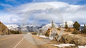 Kootenay Plains landscape with highway, clouds and blue sky