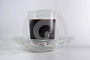 Kopi Tubruk in transparant cup with saucer
