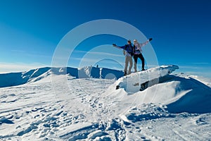 Kor Alps - Couple in snowshoes on snow covered mountains of Kor Alps, Lavanttal Alps, Carinthia Styria, Austria. Winter wonderland