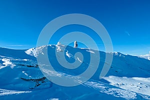 Kor Alps - Panoramic view of austro control Goldhaube on snow covered mountain peak Grosser Speikogel in Kor Alps