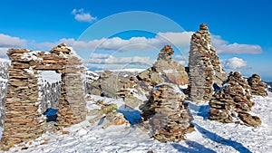 Kor Alps - Snow covered massive unique stones display on mountain peak Steinmandl in Kor Alps, Lavanttal Alps