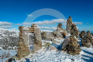 Kor Alps - Snow covered massive unique stones display on mountain peak Steinmandl in Kor Alps, Lavanttal Alps
