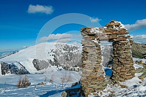 Kor Alps - Snow covered massive unique stones display on mountain peak Steinmandl in Kor Alps, Lavanttal Alps