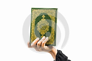 Koran in hand - holy book of Muslims( public item of all muslims )Koran in hand muslims woman