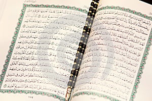 Koran holy book with rosary