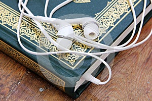 Koran islamic holy book with headset concept